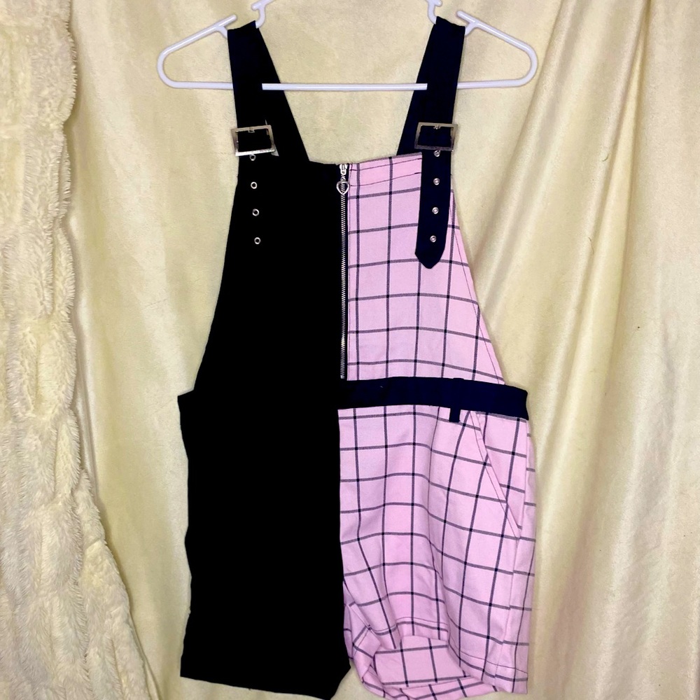 Half pink plaid and half black overalls with belt loop